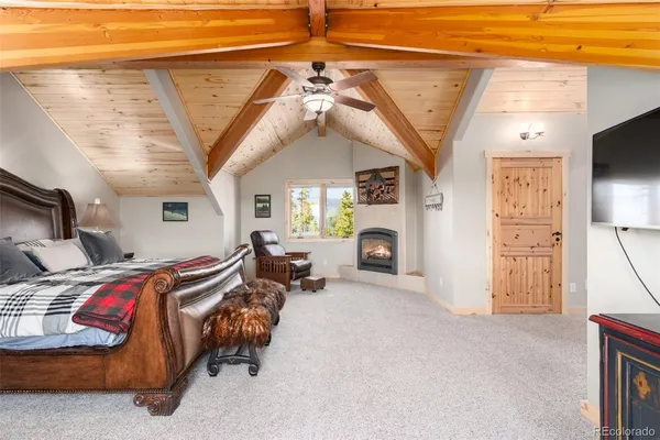a bed room with a bed and a chair