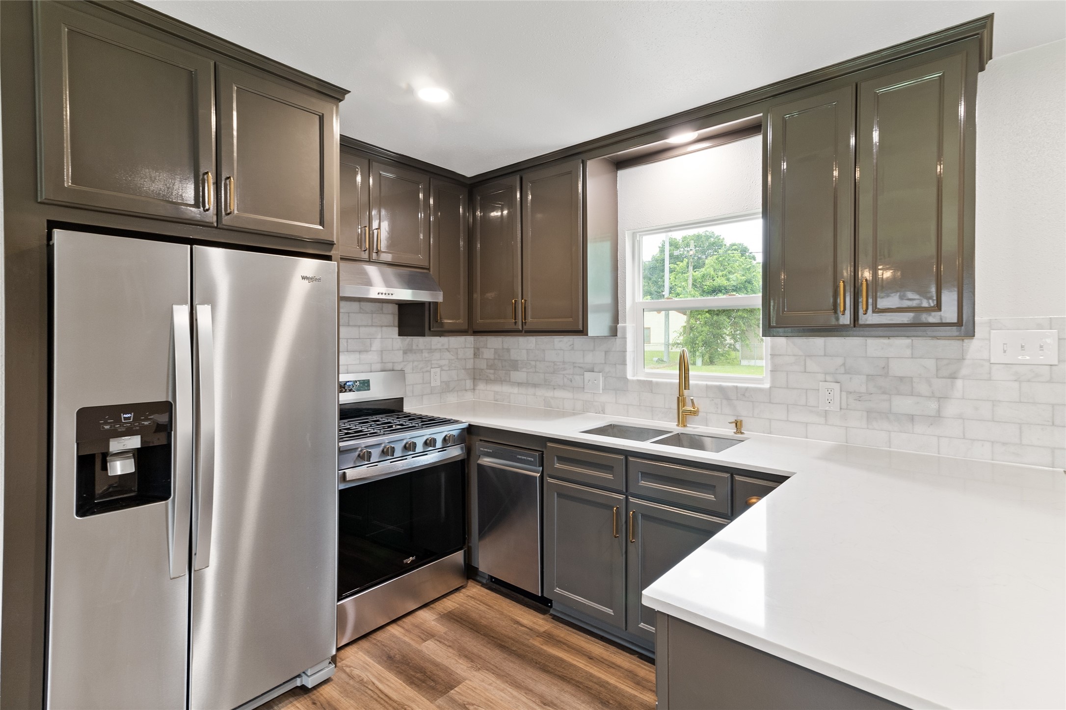 1108 Nottingham Drive Angleton, TX 77515 - Photo 6 of 23 a kitchen with stainless steel appliances granite countertop a refrigerator a sink and dishwasher