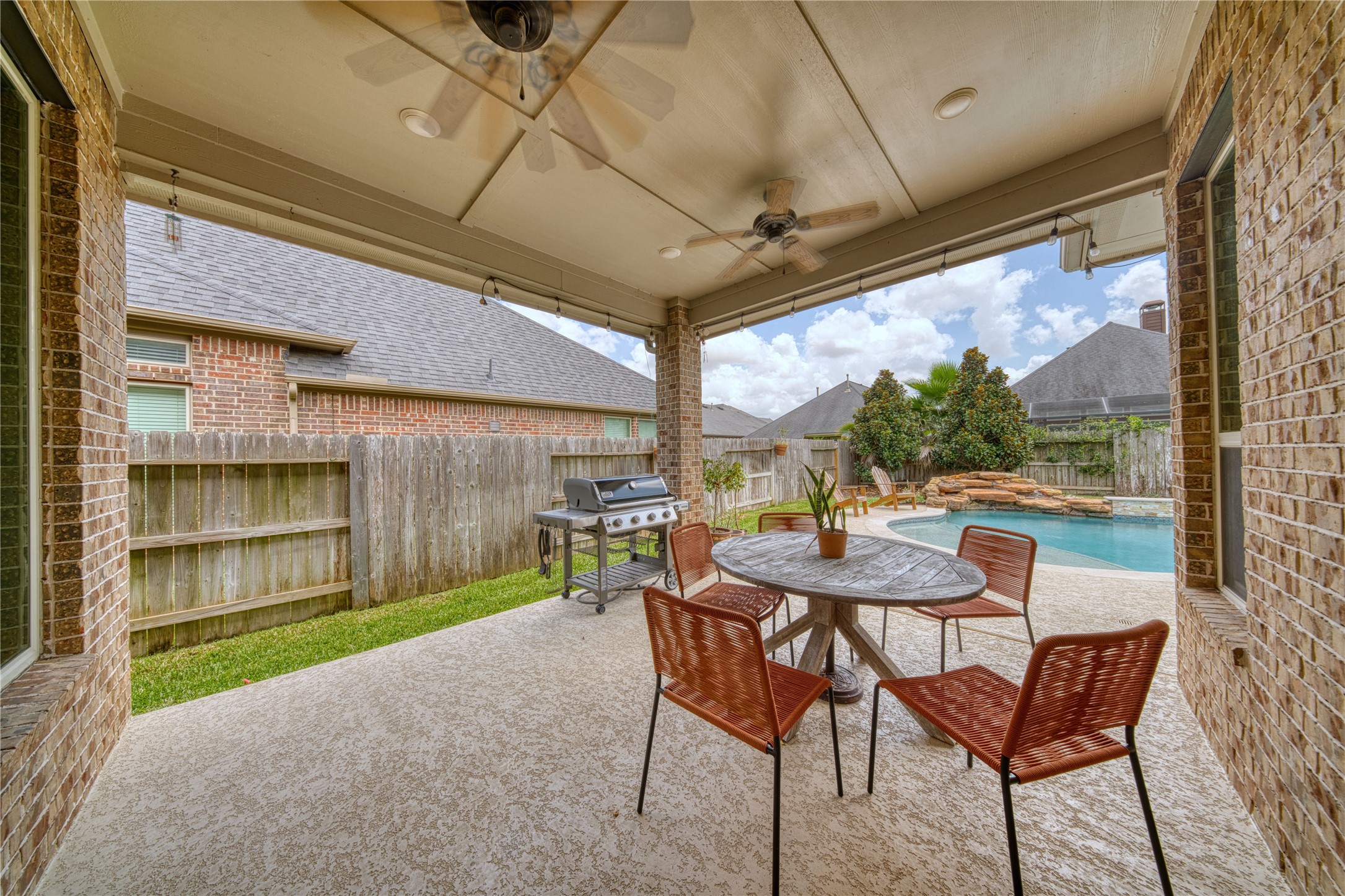 29311 Ribbongrass Court Katy, TX 77494 - Photo 7 of 21 back yard with a pool and jacuzzi