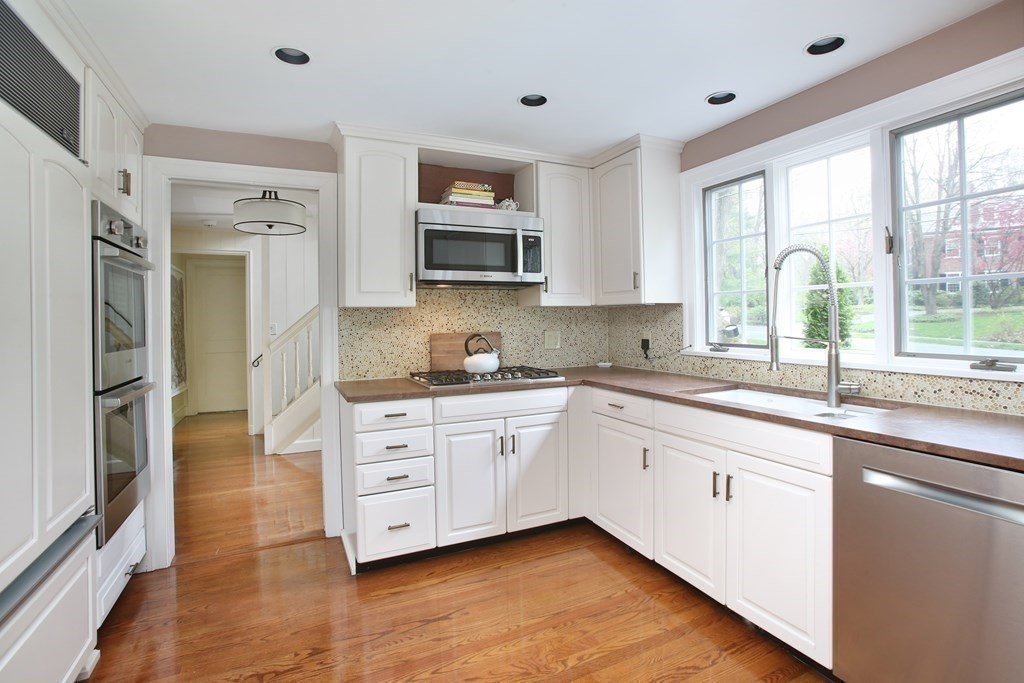 34 Greenwood Road Wellesley, MA 02481 - Photo 5 of 35 a kitchen with stainless steel appliances granite countertop a stove a sink and a refrigerator