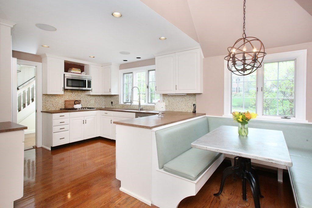 34 Greenwood Road Wellesley, MA 02481 - Photo 7 of 35 a kitchen with a table chairs sink and cabinets