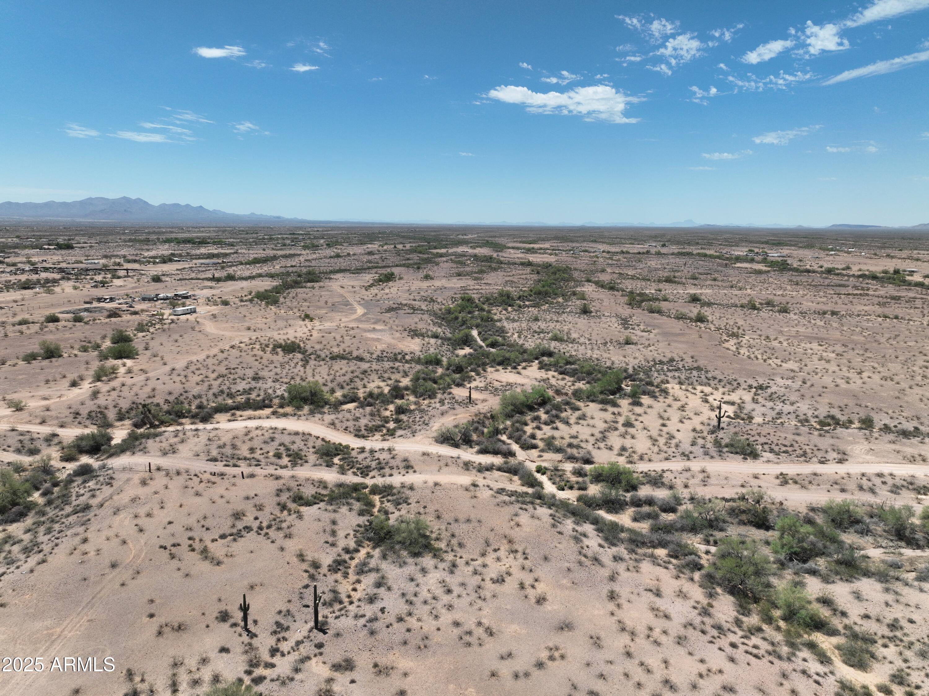 0 West Lone Mountain Road, Unit 139 Wittmann, AZ 85361 - Photo 11 of 11 a view of a beach and a yard