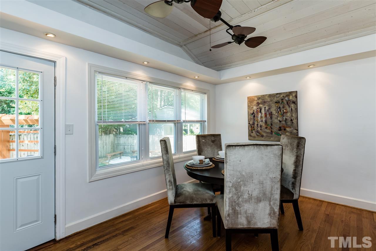 508 Banks Street Raleigh, NC 27604 - Photo 14 of 25 a view of a dining room with furniture window and wooden floor