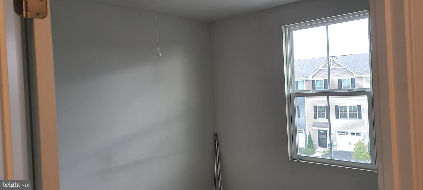 1047 Wickersham Way Middletown, DE 19709 - Photo 13 of 18 a view of an empty room with a window