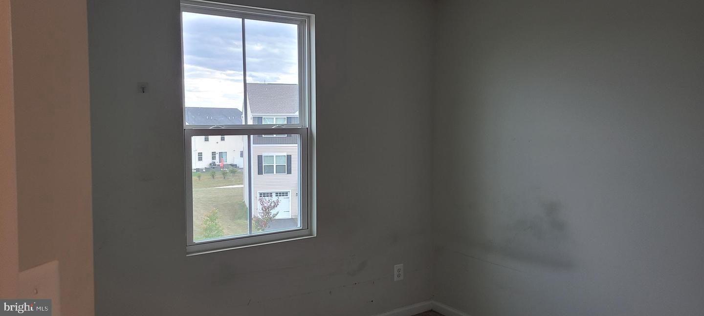1047 Wickersham Way Middletown, DE 19709 - Photo 14 of 18 an empty room with windows