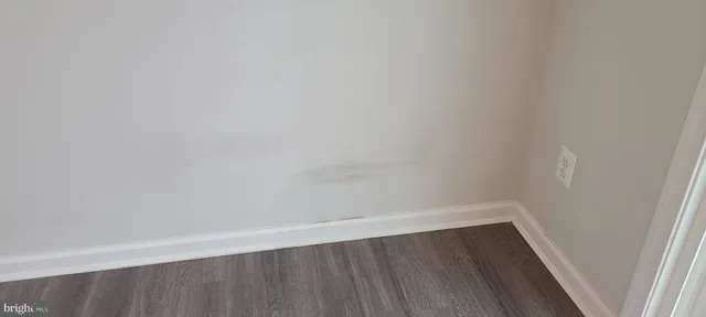 a view of wooden floor in a small shelf