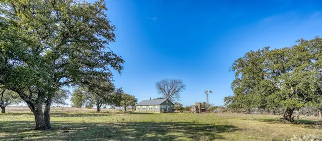 a view of backyard with green space