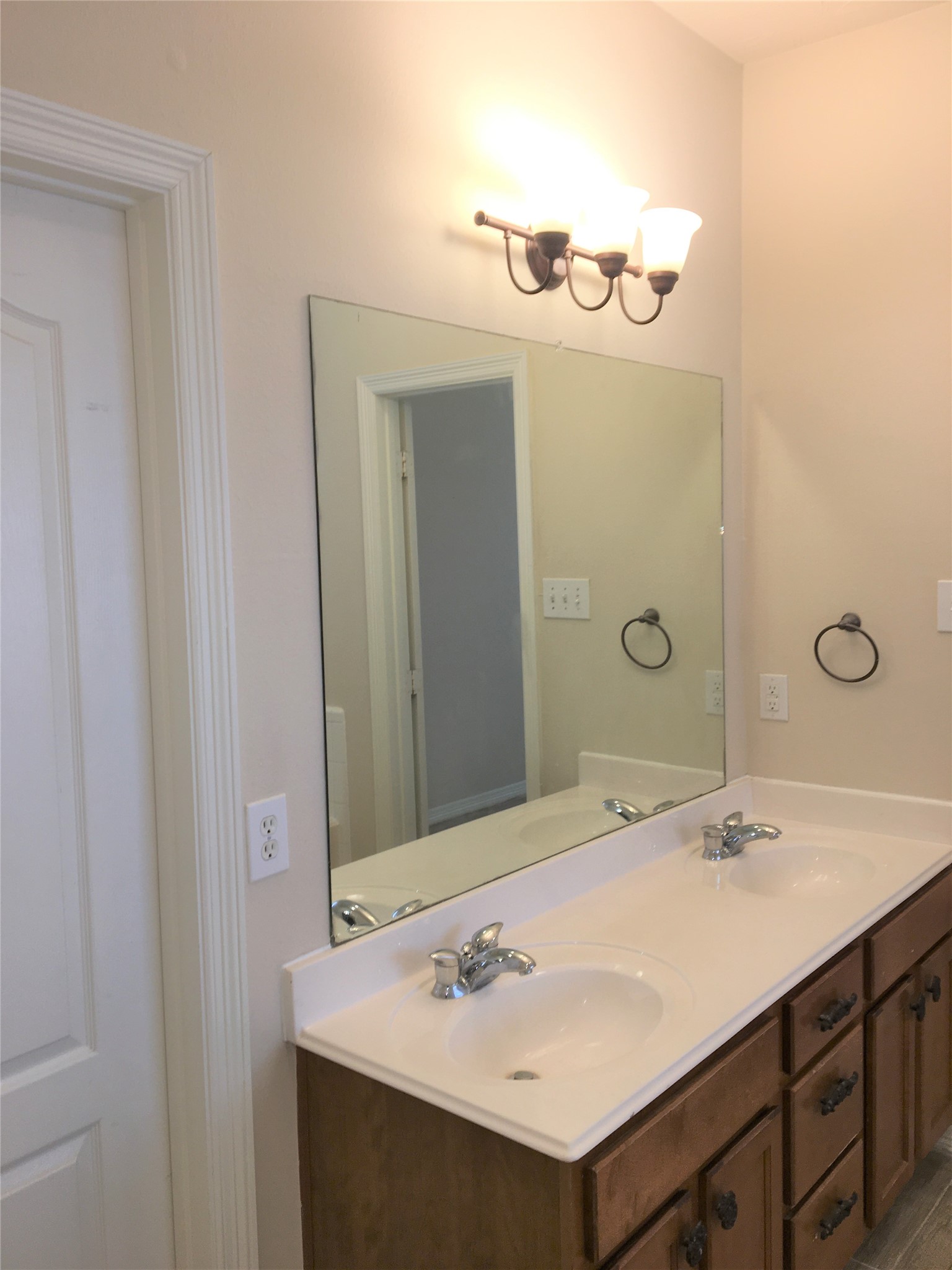 2214 Valley View Crossing Conroe, TX 77304 - Photo 22 of 23 a bathroom with a sink and a mirror