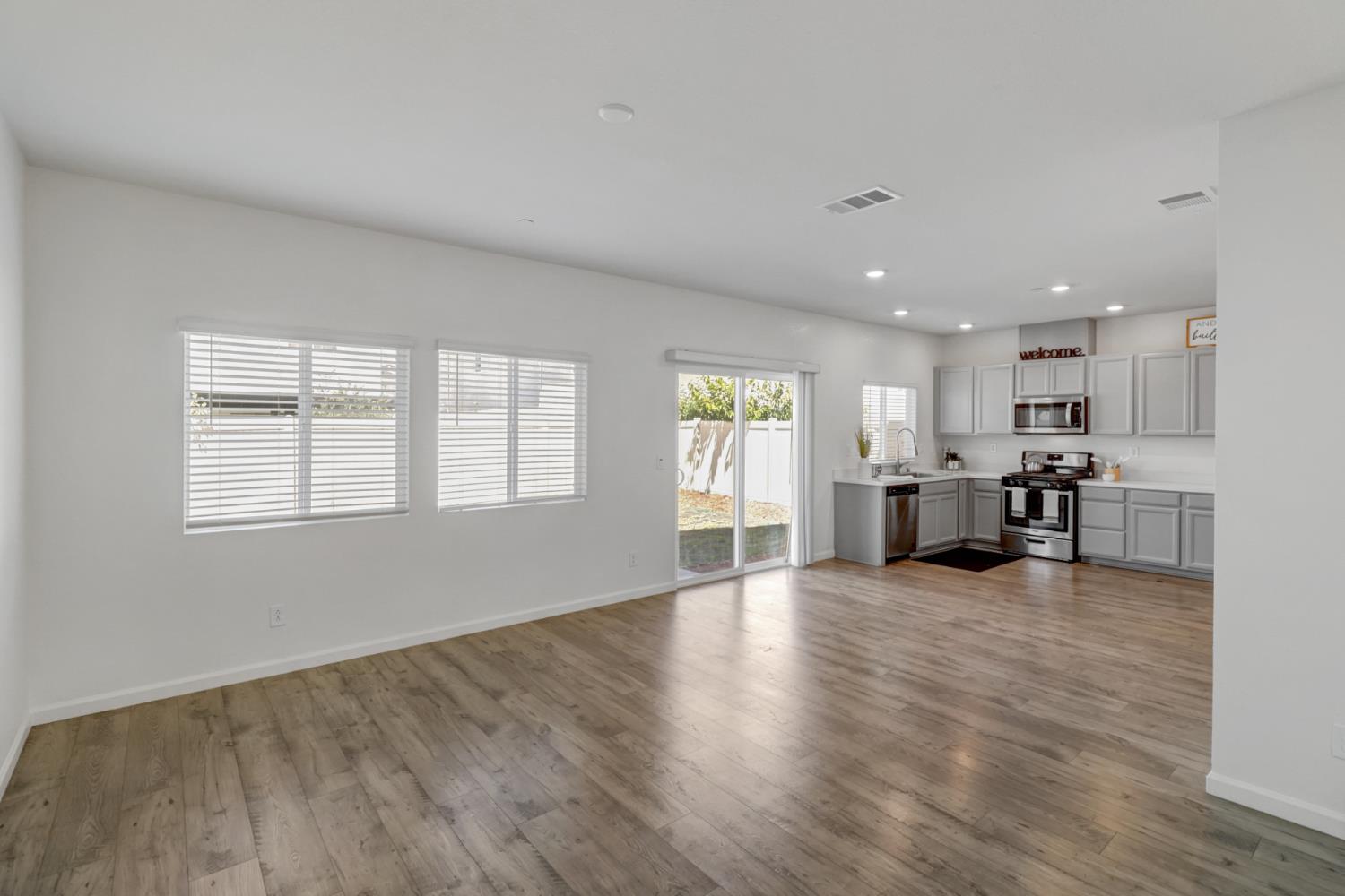 2887 Krone Way Antelope, CA 95843 - Photo 4 of 46 a view of an empty room with window and wooden floor