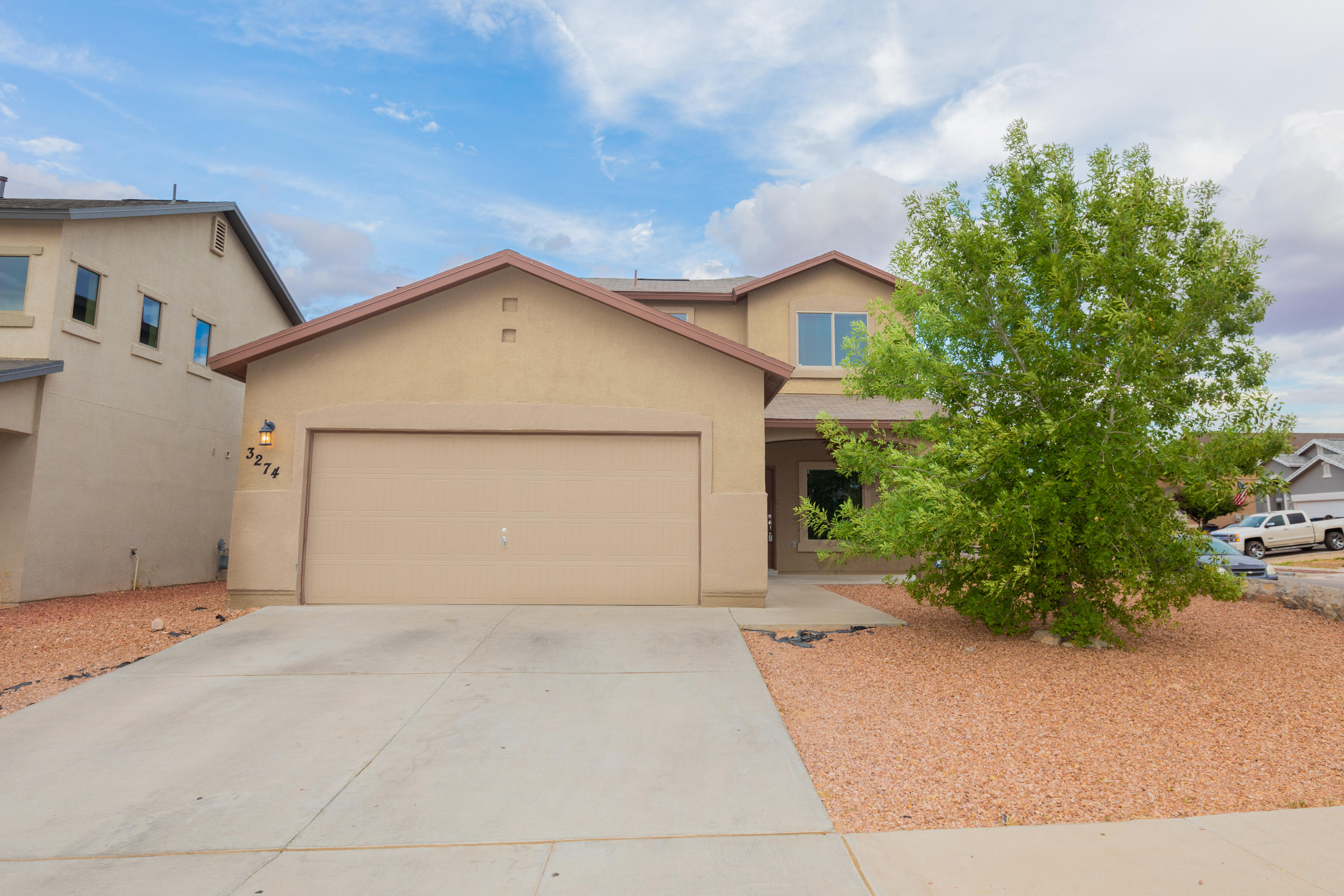 a view of garage and yard