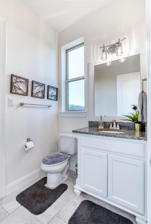 901 Inverness Court Lucas, TX 75002 - Photo 19 of 40 Bathroom featuring vanity and baseboards