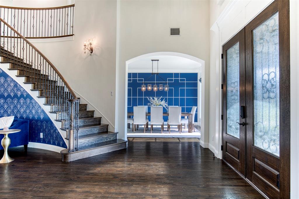 901 Inverness Court Lucas, TX 75002 - Photo 2 of 40 Entryway featuring french doors, a high ceiling, plenty of natural light, dark wood-style floors, and arched walkways