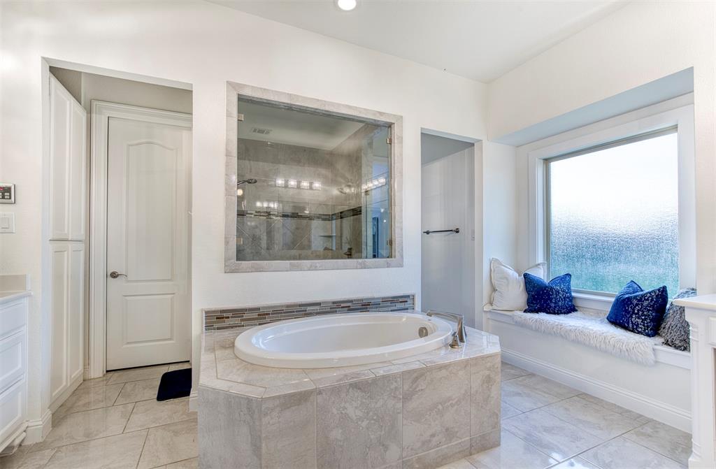 901 Inverness Court Lucas, TX 75002 - Photo 21 of 40 Bathroom with vanity, a stall shower, and a bath