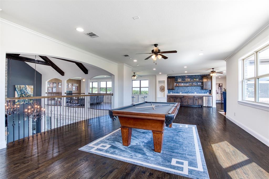 901 Inverness Court Lucas, TX 75002 - Photo 28 of 40 Recreation room with billiards, bar, healthy amount of natural light, dark wood finished floors, and vaulted ceiling with beams
