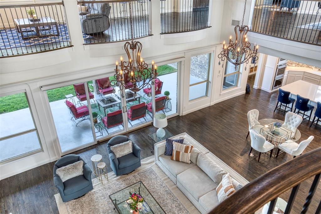 901 Inverness Court Lucas, TX 75002 - Photo 35 of 40 Living area with a high ceiling, a chandelier, and dark wood finished floors