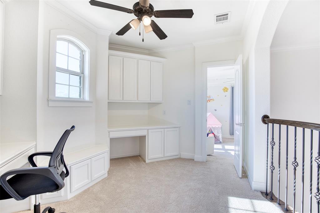 901 Inverness Court Lucas, TX 75002 - Photo 39 of 40 Unfurnished office featuring built in study area, a ceiling fan, ornamental molding, and light carpet