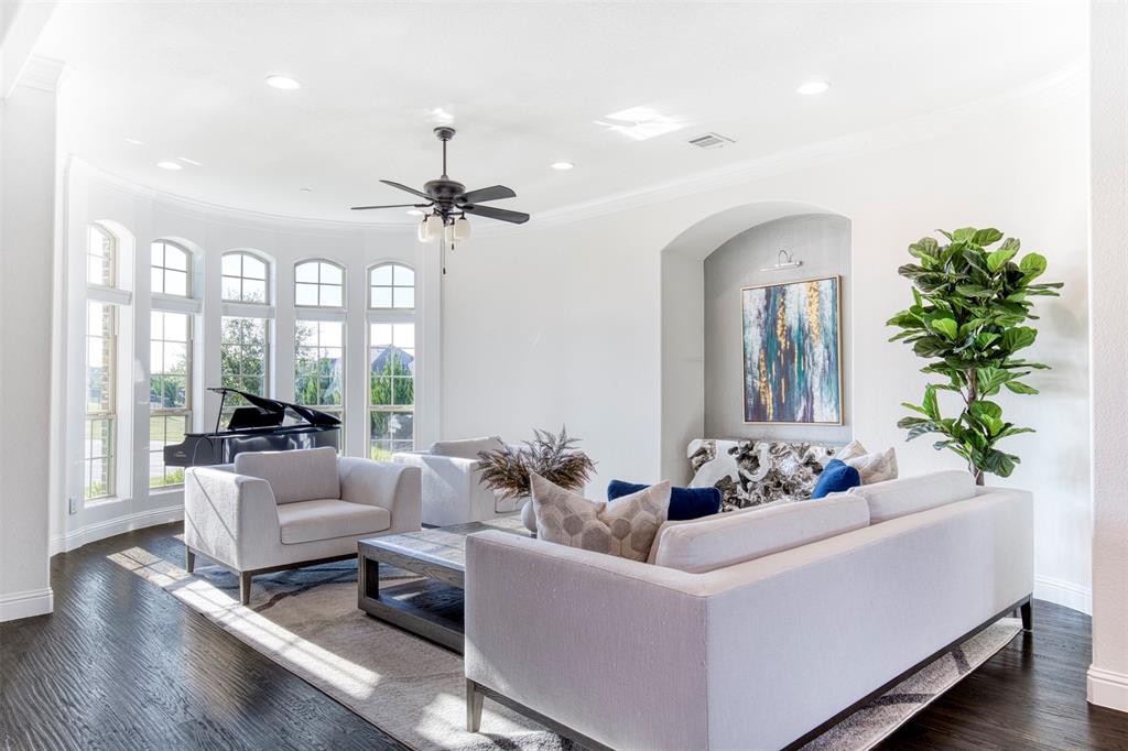 901 Inverness Court Lucas, TX 75002 - Photo 6 of 40 Living room with dark wood-type flooring, ornamental molding, a ceiling fan, arched walkways, and recessed lighting