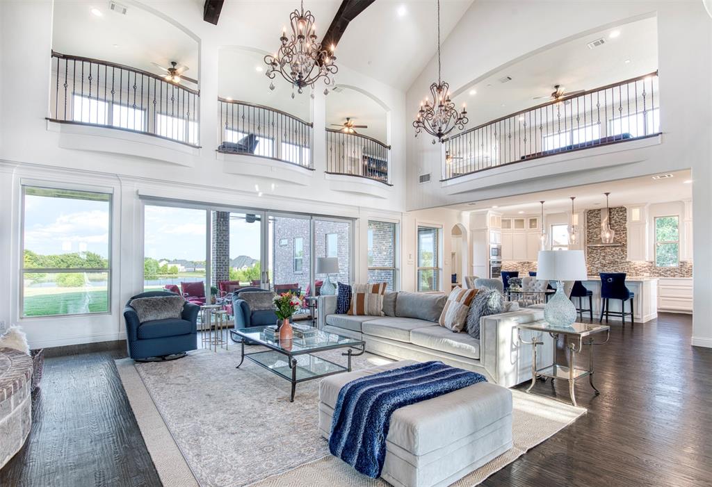 901 Inverness Court Lucas, TX 75002 - Photo 9 of 40 Living room featuring a ceiling fan, suspended lighting, dark wood-type flooring, and lofted ceiling
