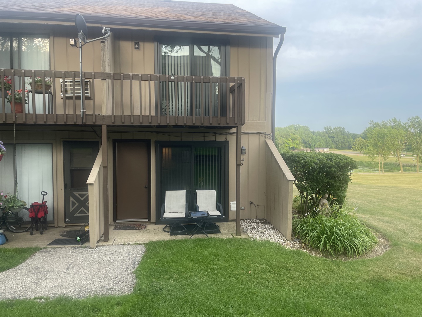 64 Aspen Colony, Unit 5 Fox Lake, IL 60020 - Photo 1 of 14 a view of a house with backyard and porch