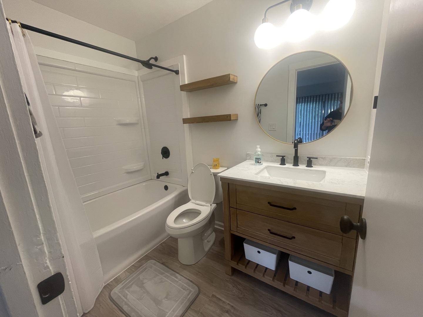 64 Aspen Colony, Unit 5 Fox Lake, IL 60020 - Photo 11 of 14 a bathroom with a sink toilet a mirror and shower