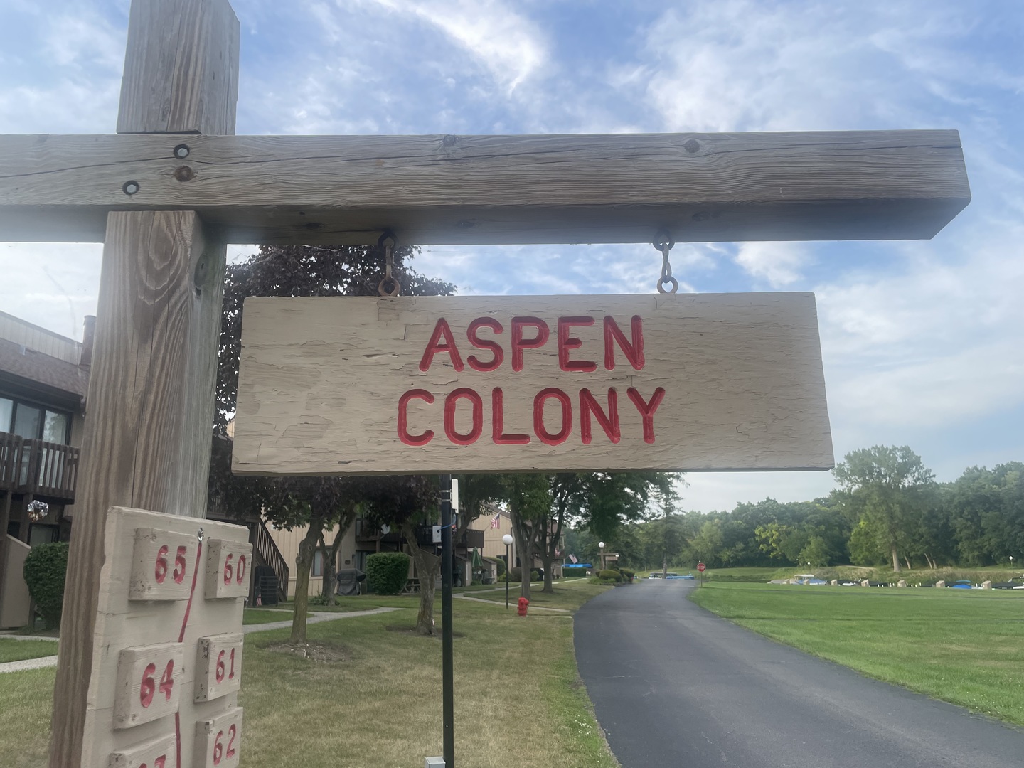 64 Aspen Colony, Unit 5 Fox Lake, IL 60020 - Photo 2 of 14 a sign that is on the side of a building