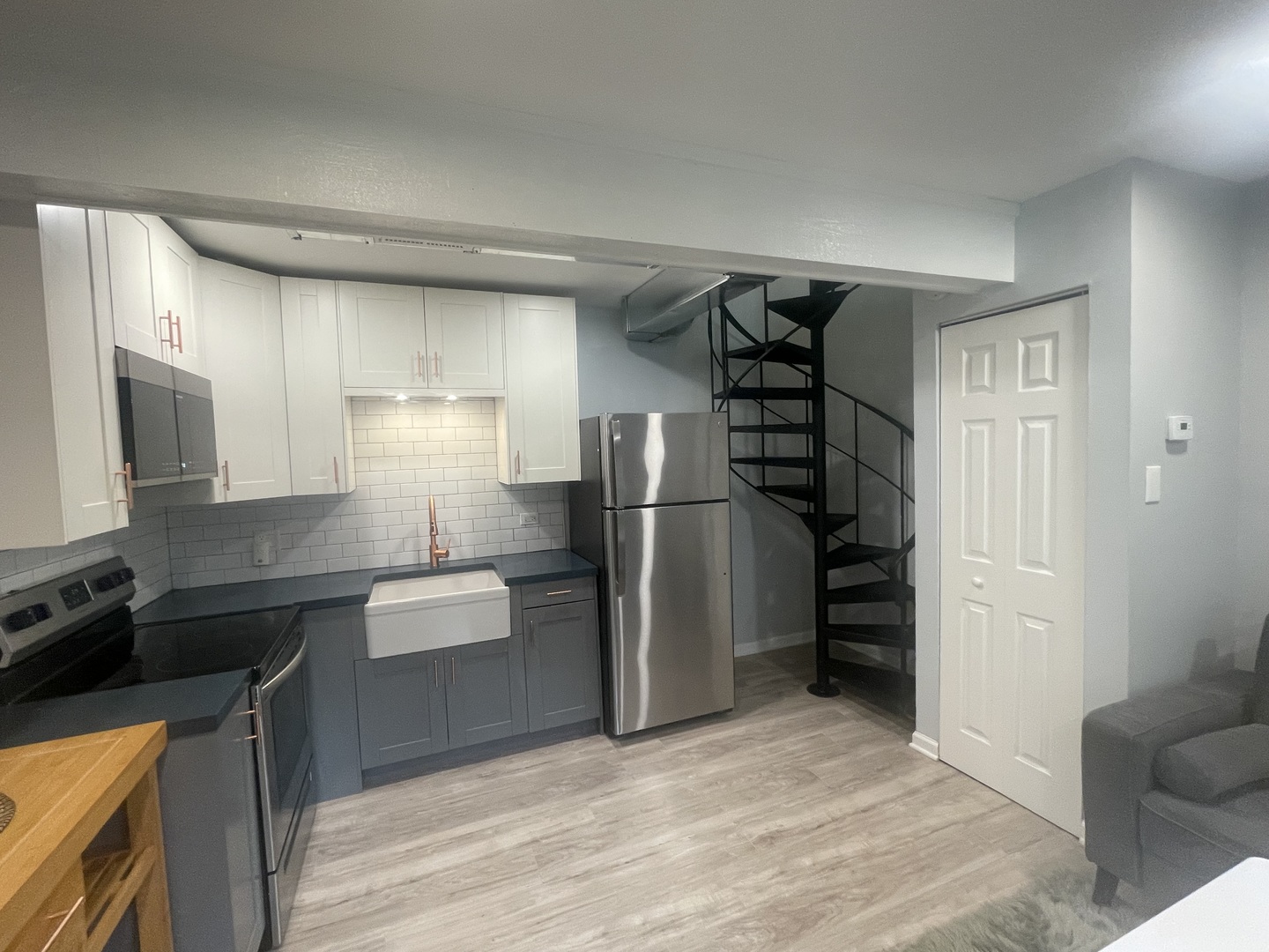 64 Aspen Colony, Unit 5 Fox Lake, IL 60020 - Photo 8 of 14 a kitchen with stainless steel appliances granite countertop a refrigerator and a sink