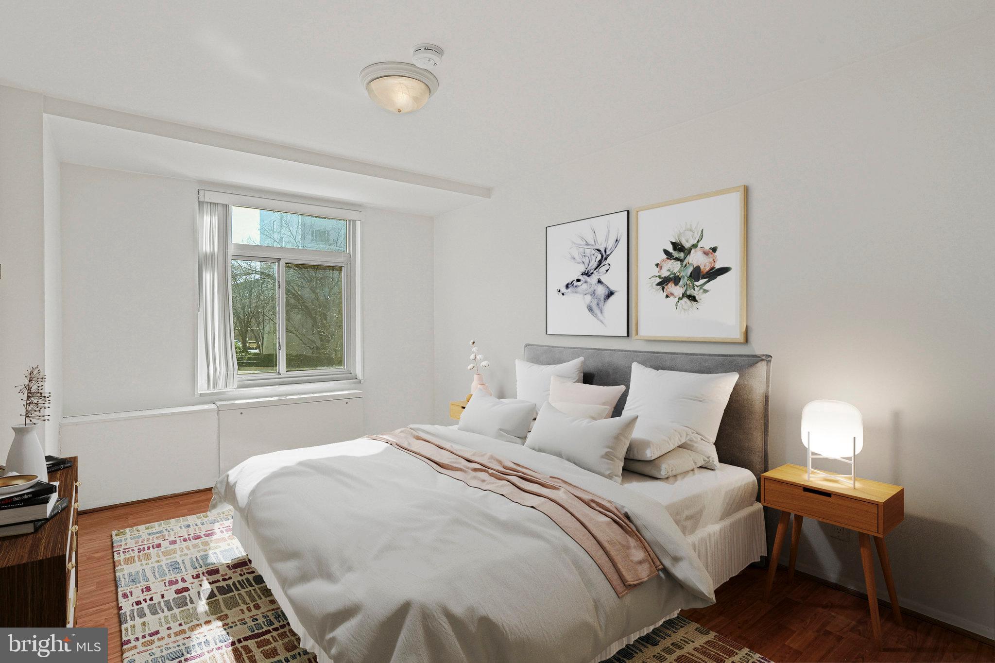 2401 H Street Northwest, Unit 202 Washington, DC 20037 - Photo 9 of 23 Large bedroom with step in closet.