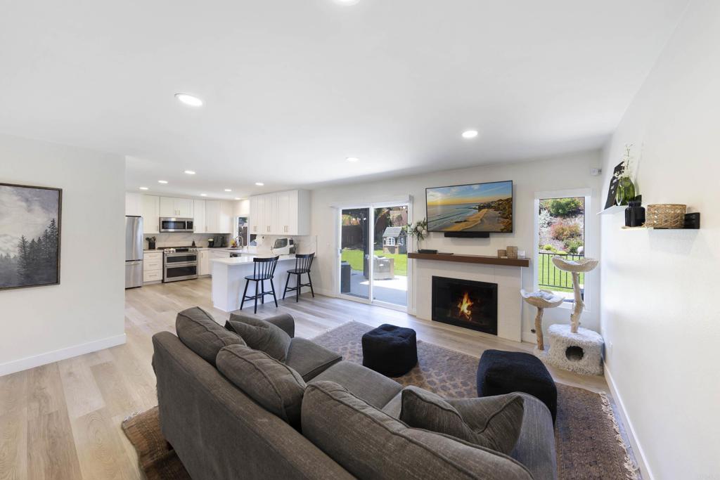 3577 Winslow Road Oceanside, CA 92056 - Photo 15 of 53 a living room with furniture and a fireplace