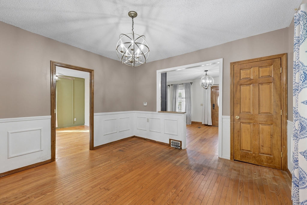 72 Highland Avenue Ludlow, MA 01056 - Photo 12 of 32 an empty room with wooden floor and windows