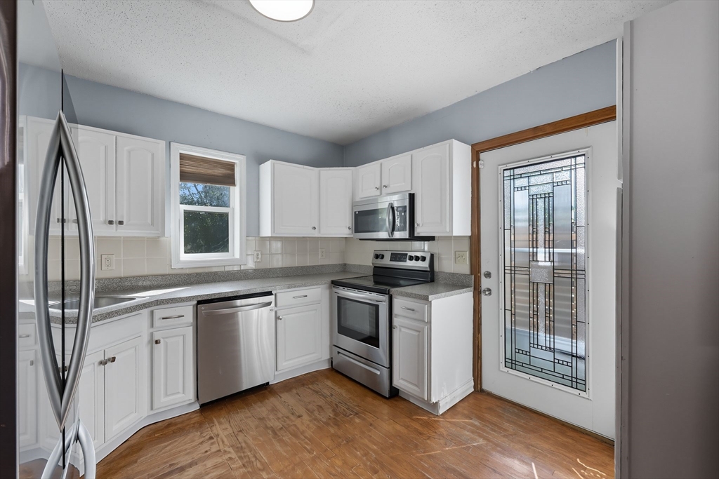 72 Highland Avenue Ludlow, MA 01056 - Photo 15 of 32 a kitchen with stainless steel appliances granite countertop a stove a sink and a refrigerator