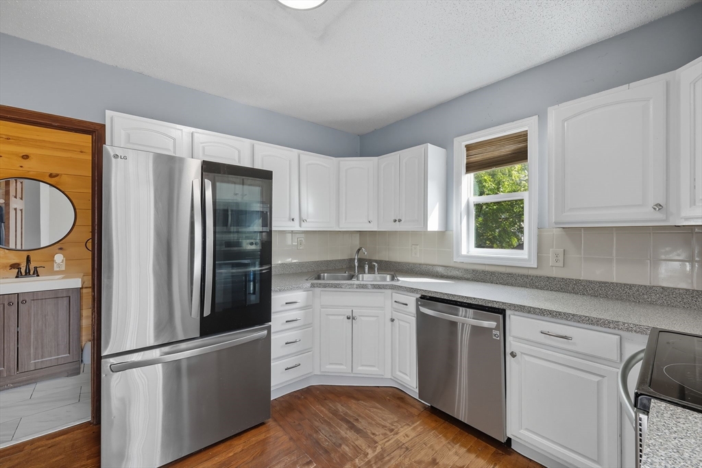 72 Highland Avenue Ludlow, MA 01056 - Photo 16 of 32 a kitchen with a refrigerator stove top oven and sink