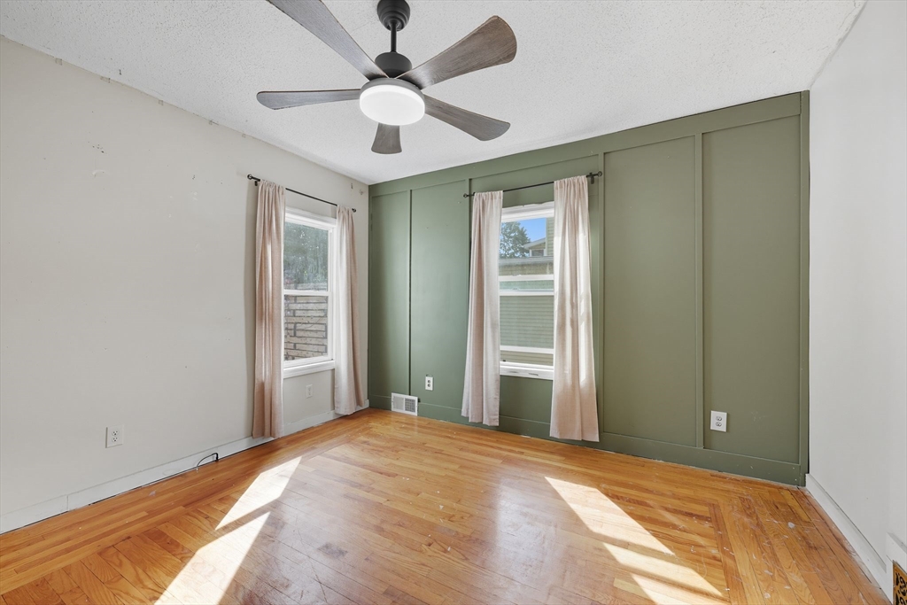 72 Highland Avenue Ludlow, MA 01056 - Photo 19 of 32 a view of a bedroom with a ceiling fan and a window