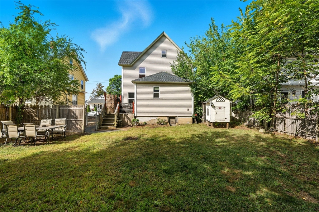 72 Highland Avenue Ludlow, MA 01056 - Photo 30 of 32 a front view of house with yard and trees