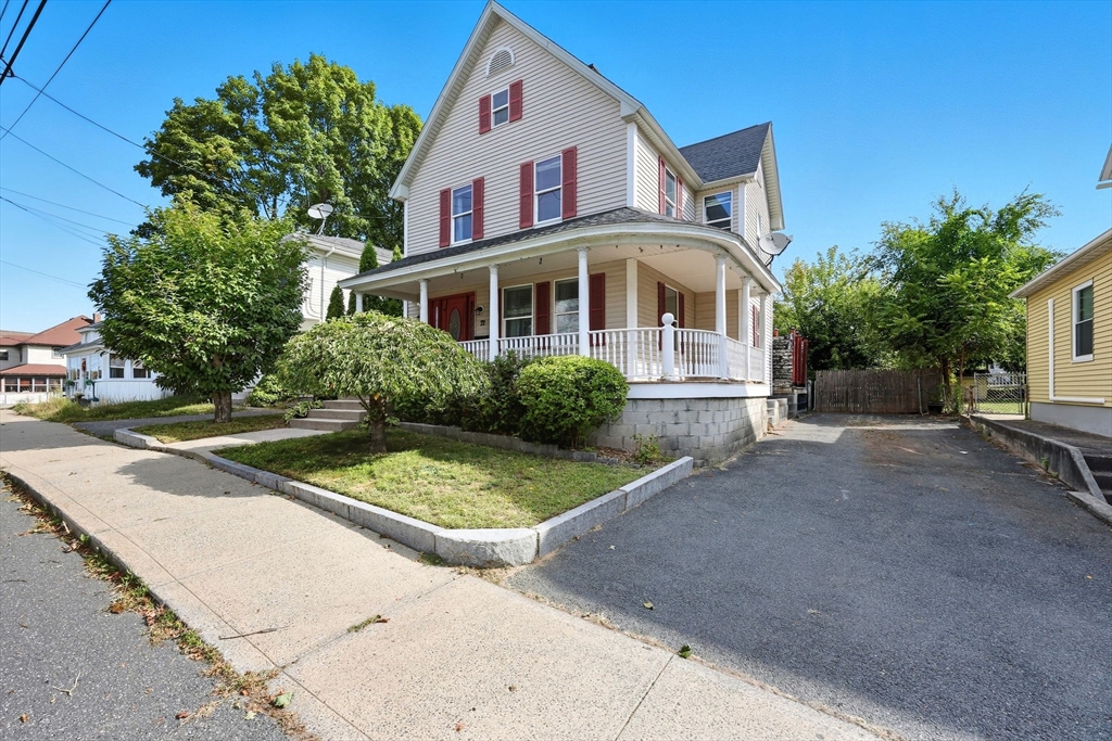 72 Highland Avenue Ludlow, MA 01056 - Photo 3 of 32 a front view of a house with garden