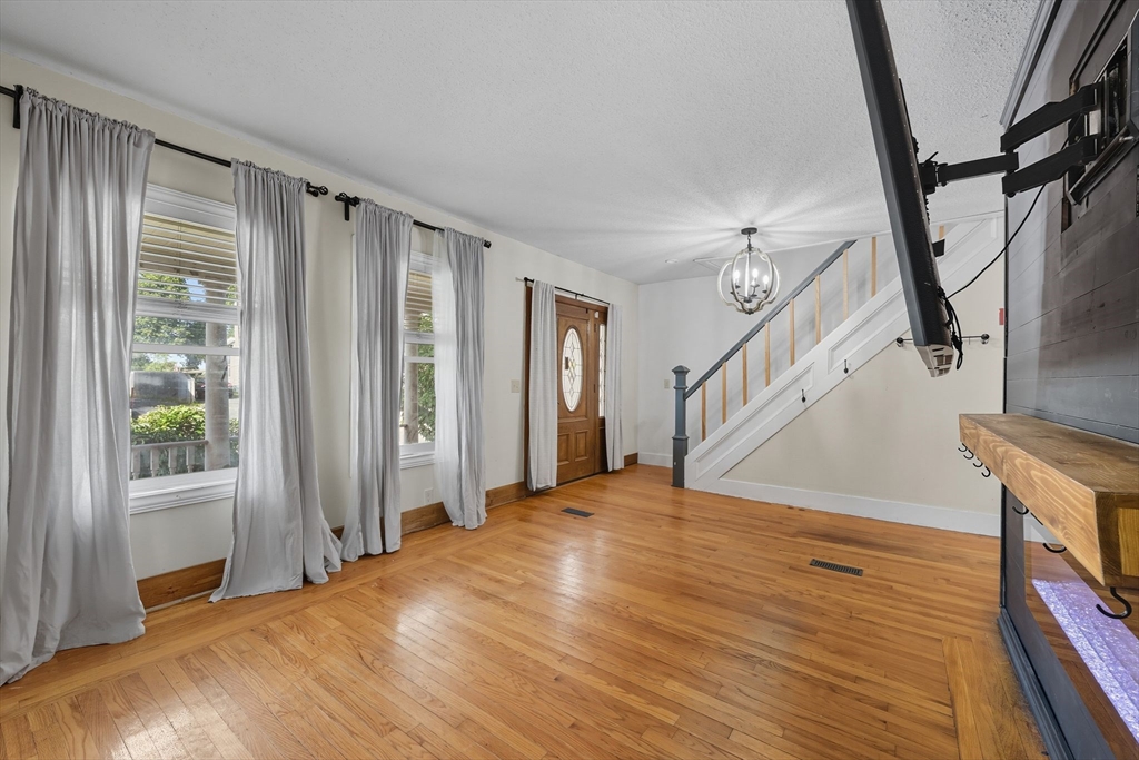 72 Highland Avenue Ludlow, MA 01056 - Photo 10 of 32 a view of empty room with wooden floor and fan