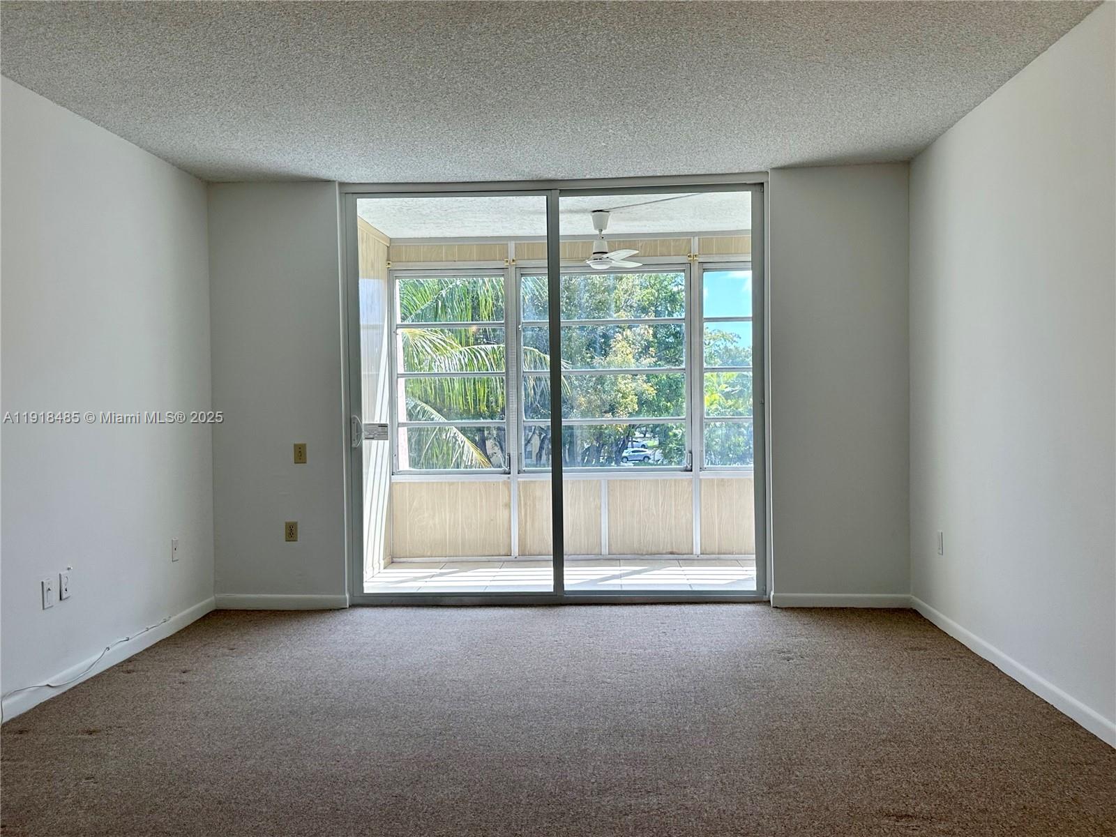 9101 Lime Bay Boulevard, Unit 302 Tamarac, FL 33321 - Photo 12 of 34 a view of empty room with window