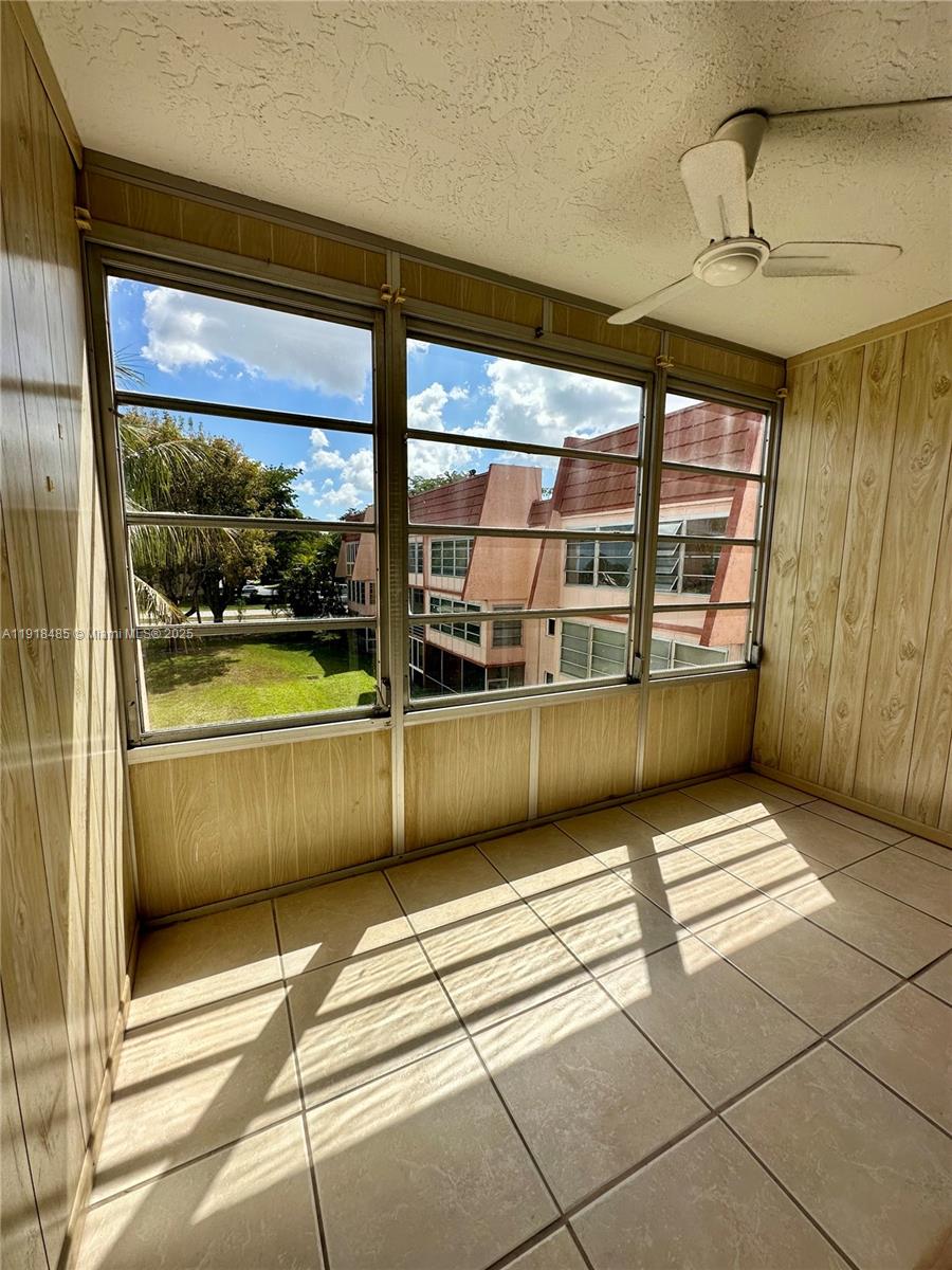 9101 Lime Bay Boulevard, Unit 302 Tamarac, FL 33321 - Photo 14 of 34 a view of a building from a balcony