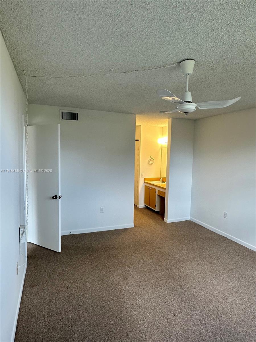 9101 Lime Bay Boulevard, Unit 302 Tamarac, FL 33321 - Photo 18 of 34 a view of empty room