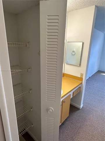 a view of small space with racks on the wall