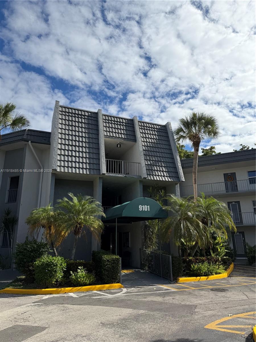 9101 Lime Bay Boulevard, Unit 302 Tamarac, FL 33321 - Photo 26 of 34 a front view of a house
