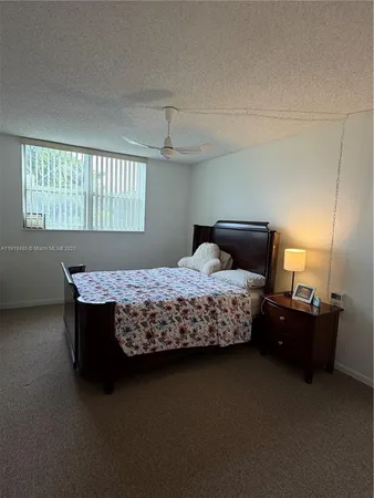 a bed room with furniture and a chandelier