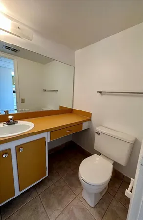 a kitchen with a cabinets and white appliances