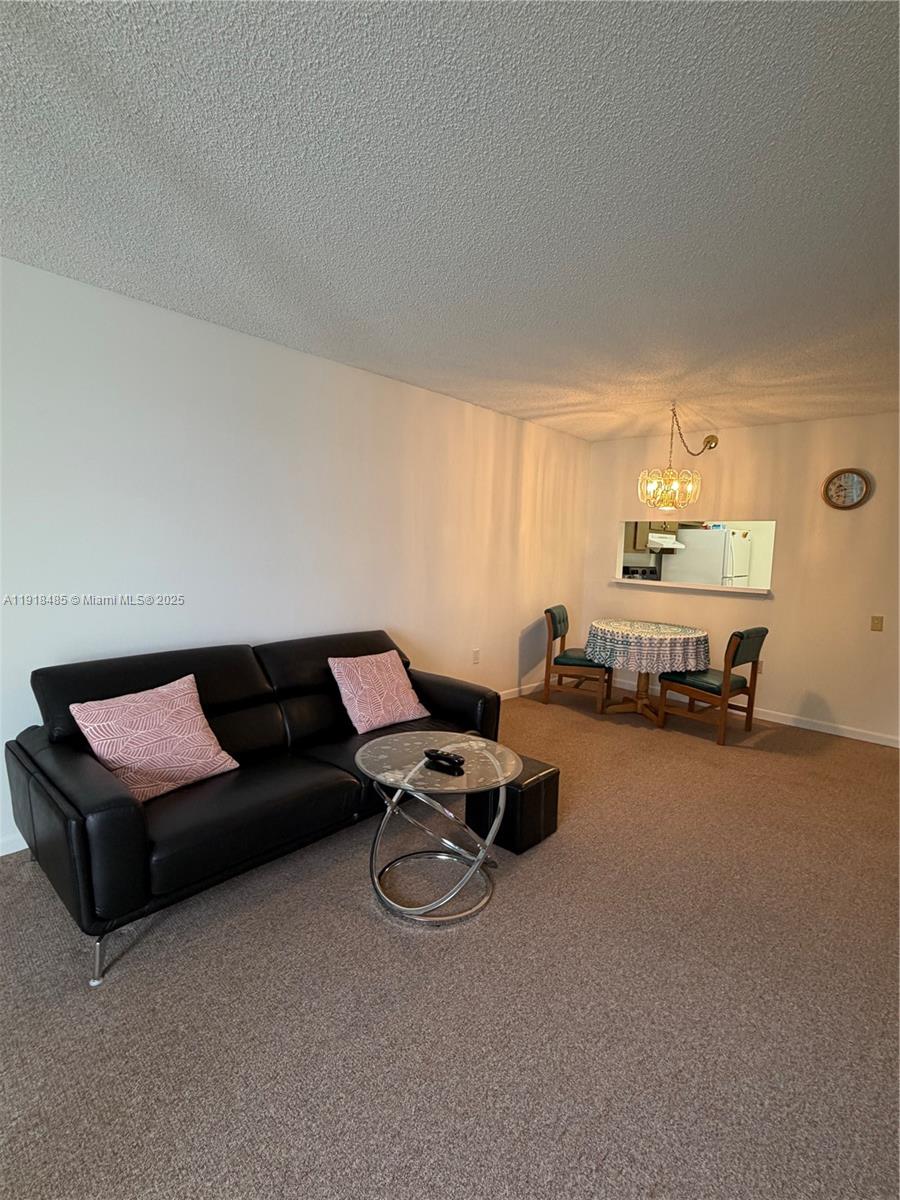 9101 Lime Bay Boulevard, Unit 302 Tamarac, FL 33321 - Photo 34 of 34 a living room with furniture