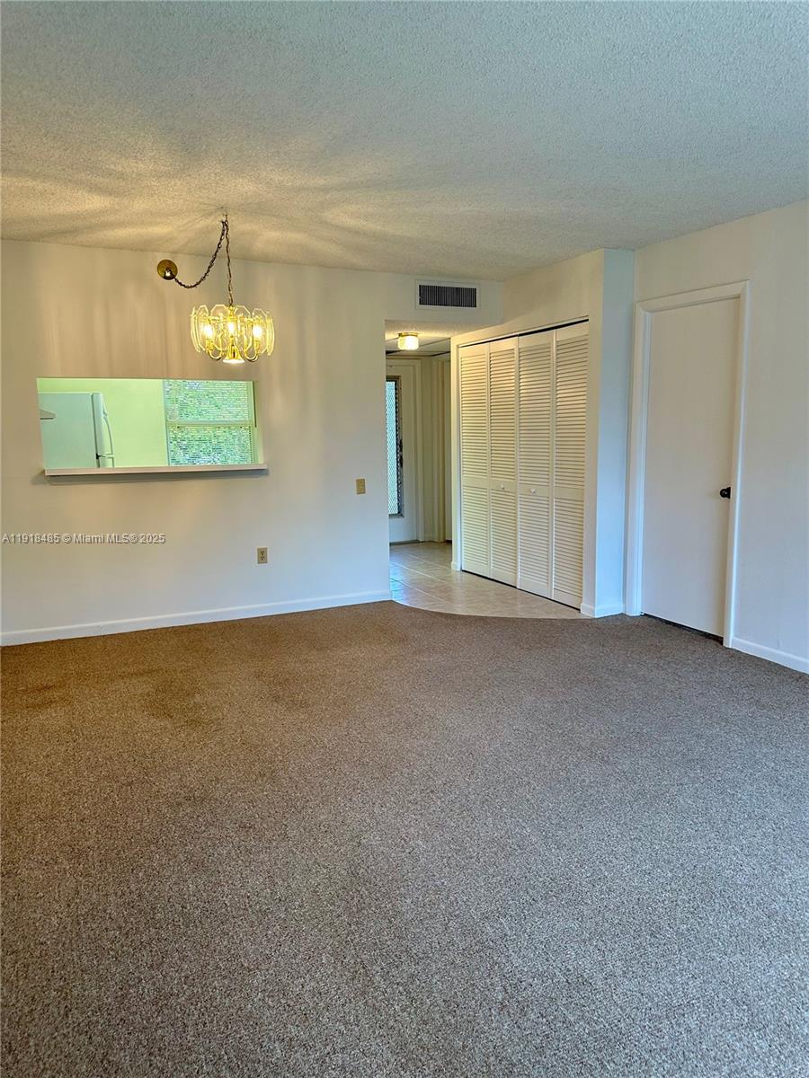 9101 Lime Bay Boulevard, Unit 302 Tamarac, FL 33321 - Photo 9 of 34 a view of an empty room