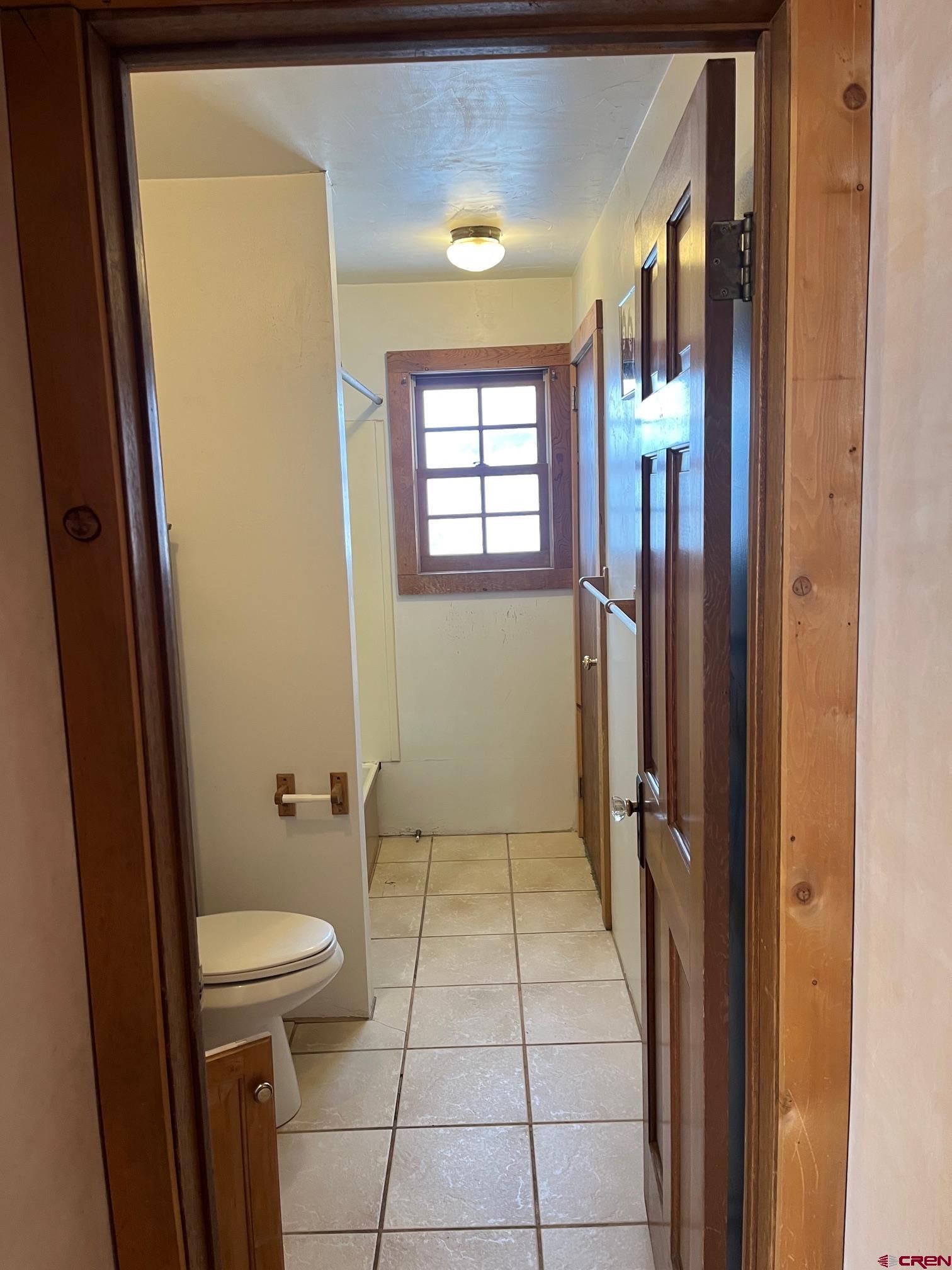 214 North Amelia Street Ridgway, CO 81432 - Photo 11 of 18 a bathroom with a toilet and a shower