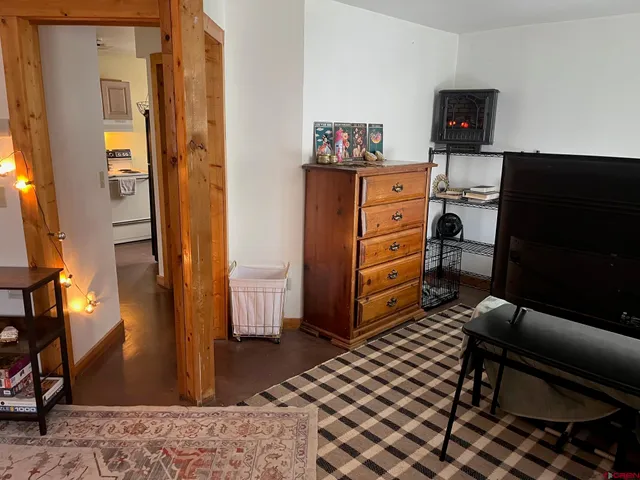 a bedroom with a bed and furniture