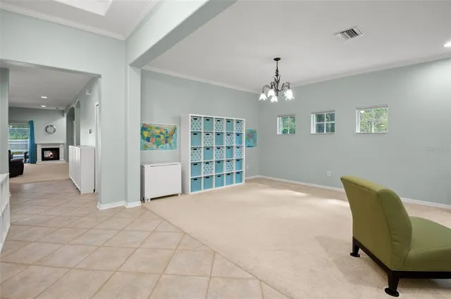 a living room with furniture and kitchen view