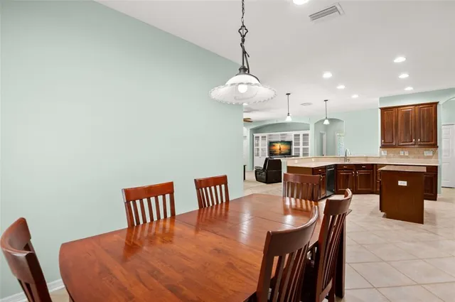 a bedroom with a bed and a ceiling fan