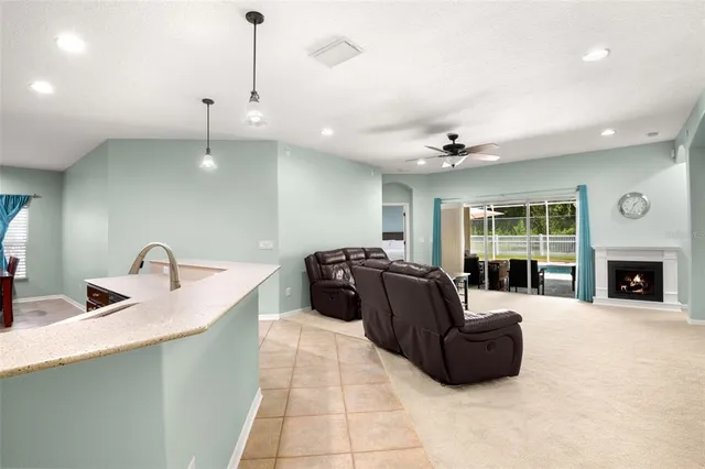 a bathroom with a granite countertop sink a bathtub and a mirror