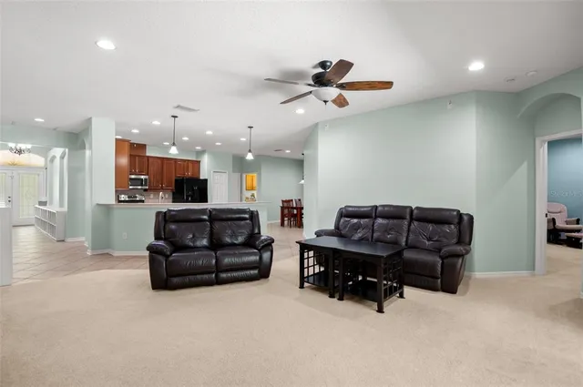 a bathroom with a granite countertop sink toilet a mirror a shower and a bathtub